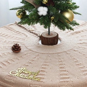 Knitted Christmas tree skirt in oatmeal with textured check pattern and wood buttons