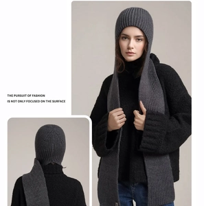 Detail of thick ribbed knit texture on deep grey hooded scarf with elegant back view