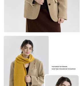 Detail of bright yellow ribbed knit scarf showing texture and vintage style pairing