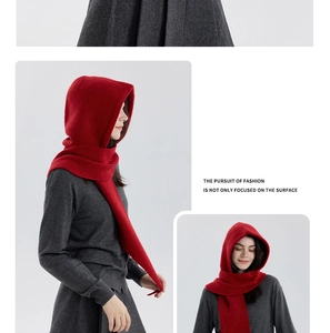 Detail of red hooded knitted scarf showing thick vertical rib texture and warmth