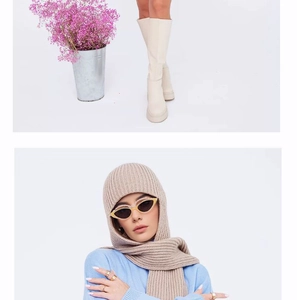 Detail of beige knitted hooded scarf with textured fabric and matching boots