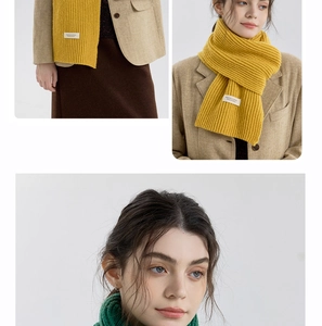 Detailed close-up of thick ribbed knit texture on a soft yellow and green winter scarf