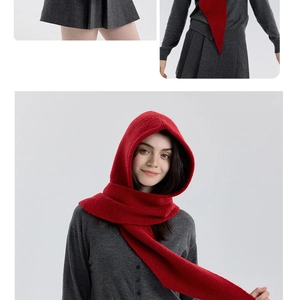 Detailed knit texture and styling of a red hooded scarf for winter protection