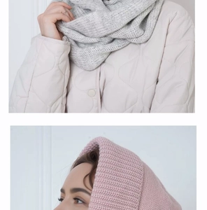 Detail of soft knit neck warmer and hood scarf in grey and dusty pink colors