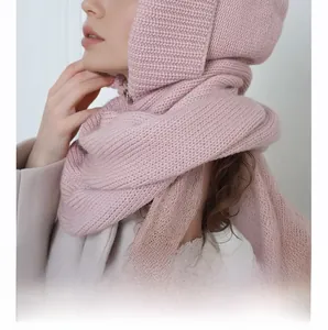 Close-up of pink knitted balaclava hood scarf with thick knit texture and warm material