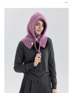 Detail of pink-purple wool blend balaclava with chunky knit texture and white buttons