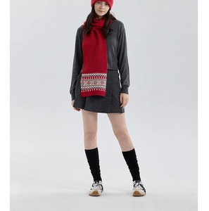 Full view of model wearing Fair Isle red knit scarf and hat set for winter warmth