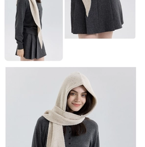 Detailed close-up of beige knitted hooded scarf showing soft vertical ribbed texture