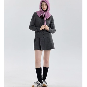 Full view of purple wool blend balaclava knit hat paired with a grey pleated skirt outfit