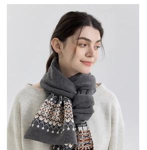 Detail of Fair Isle knit scarf featuring vintage patterns and thick warm wool texture