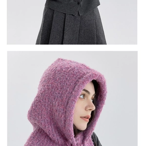 Detail of pink knit balaclava hood showing thick wool blend texture and cozy soft fibers