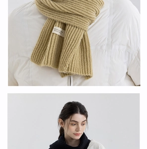 Detailed macro of thick ribbed knit texture on beige and black cashmere-like scarves