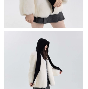 Close-up and side view of women wearing a black knitted hooded scarf with white faux fur coat