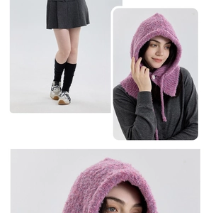 Detail of pink knitted balaclava with boucle wool texture and button closure