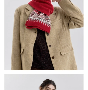 Detail of red Nordic Fair Isle knitted scarf paired with khaki herringbone blazer