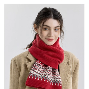 Detail of red Nordic Fair Isle knitted scarf with geometric jacquard patterns