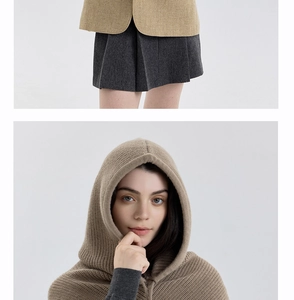 Detail of khaki knitted balaclava hood with drawstring showing soft winter fabric texture