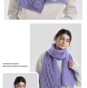 Detail of purple chunky knit scarf featuring cable stitch and floral 3D crochet textures