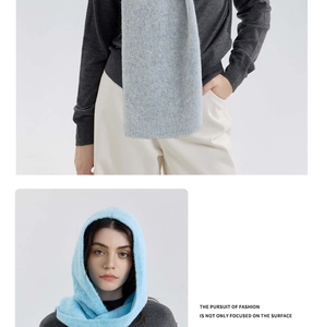 Detail of light blue mohair knit hooded scarf showing soft fluffy texture and hood fit