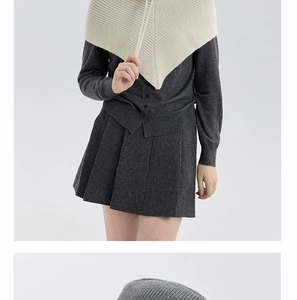 Detail of grey knitted balaclava hood with drawstring and soft textured knit material