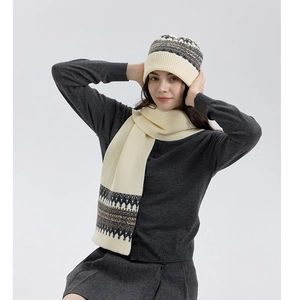 Detail of Nordic Fair Isle knit pattern on soft winter warm scarf with geometric texture