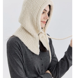 Close-up of cream wool blend balaclava showing thick knit texture and side button detail