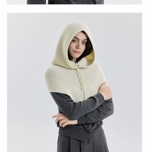 Detail of off-white knitted balaclava with adjustable drawstring for winter warmth