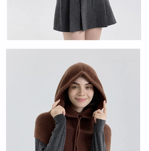 Detail of a brown knitted balaclava hoodie with drawstring and thick texture for winter