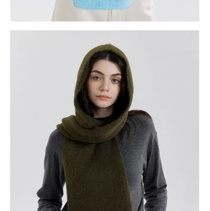 Detail shot of olive green knitted hooded scarf with thick texture and warm finish