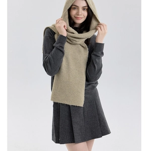 Detail of khaki hooded knit scarf showing soft fuzzy texture and integrated shawl design