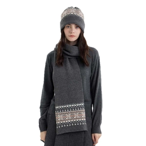 Fair Isle knit hat and scarf set with geometric patterns in grey and orange for winter