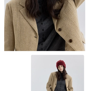 Detail of burgundy wool knit hat texture and premium khaki herringbone suit fabric