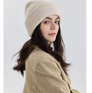 Detail of premium beige double-layer wool knit beanie with thick texture and cozy fit