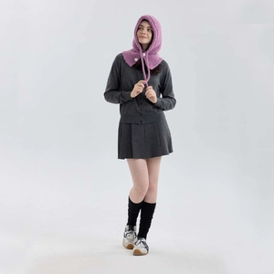 Purple wool knit balaclava hat with white buttons and ties worn by a model