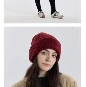 Close-up of thick double-layered wool knit beanie in burgundy for winter warmth