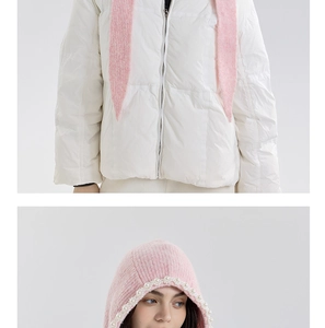 Detail of pink knitted hood with faux pearl trim and soft mohair texture for winter