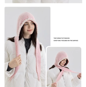 Detailed close-up of pink knitted balaclava hood featuring delicate hand-stitched pearls