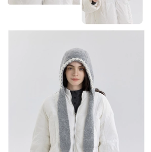 Detail of grey knitted balaclava with pearl trim and cozy ear protection straps