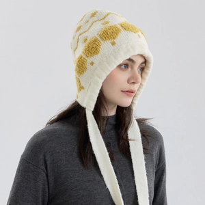 Knitted hexagonal snowflake ear protection hat in cream white with yellow pattern