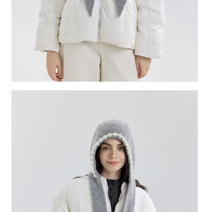 Detail view of grey chunky knit hooded scarf with elegant white pearl trim for winter