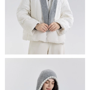 Detail of grey knitted hood with faux pearl embellishments on a white down jacket