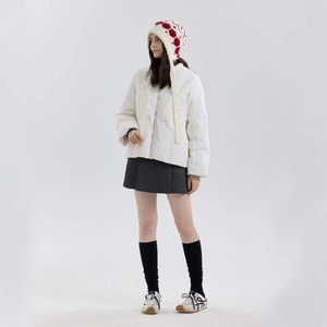 Women's warm winter knit snowflake earflap hat with tassels and white puffer jacket