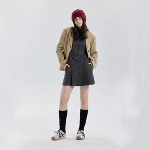 Burgundy thick wool knitted beanie shown in a vintage collegiate style autumn outfit