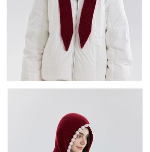 Detail of burgundy knit hooded scarf with delicate pearl floral embellishments