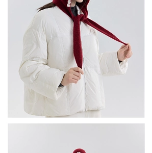 Detailed close-up of wine red knitted hooded scarf with elegant white pearl embellishments