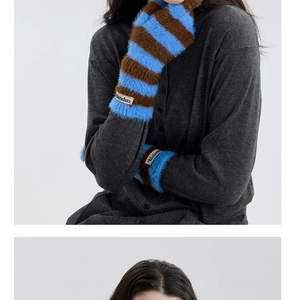 Detail of blue and brown striped faux fur arm warmers with Mulanduo woven label