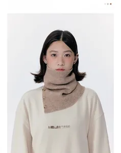Close-up of camel knit neck warmer with detailed texture and decorative dark buttons