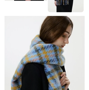 Detailed view of colorful houndstooth scarf with tassels in soft brushed mohair material