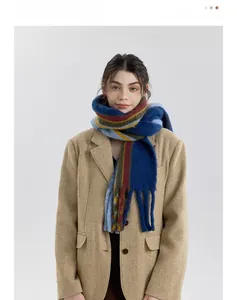 Detail of multi-color striped wool blend scarf with fringe tassels and soft fuzzy texture