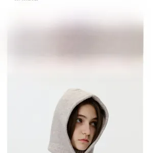 Detail view of light grey knitted balaclava hood showing warm neck protection and soft texture